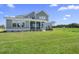 Expansive backyard featuring a well-maintained lawn and a charming porch at 2032 Sea Water Dr, Charleston, SC 29412