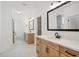 Primary bathroom featuring double vanities, marble countertops, and a large mirror at 2032 Sea Water Dr, Charleston, SC 29412