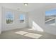 Bright and airy bedroom with neutral carpet, white walls, and natural light from multiple windows at 2032 Sea Water Dr, Charleston, SC 29412