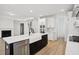 Modern kitchen with a large island, stainless steel appliances, and an open view to the living room at 2032 Sea Water Dr, Charleston, SC 29412