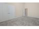 Bedroom featuring carpet flooring, walk-in closet with double doors, and gray painted walls at 2064 Promenade Ct, Mount Pleasant, SC 29466