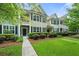 Charming townhome with black shutters, manicured landscaping, and a welcoming entrance at 2064 Promenade Ct, Mount Pleasant, SC 29466