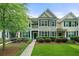 Charming townhome featuring manicured landscaping and a welcoming front porch at 2064 Promenade Ct, Mount Pleasant, SC 29466
