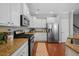 Bright kitchen featuring stainless appliances, granite counters, and white cabinetry at 2064 Promenade Ct, Mount Pleasant, SC 29466