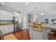 Modern kitchen features white cabinets, granite countertops, stainless steel appliances, and hardwood floors at 2064 Promenade Ct, Mount Pleasant, SC 29466