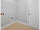 Laundry room area featuring a wire rack for storage and a white door at 2064 Promenade Ct, Mount Pleasant, SC 29466