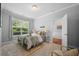 Bedroom features a large window with serene views and an ensuite bathroom at 2064 Promenade Ct, Mount Pleasant, SC 29466