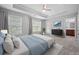 Bedroom features natural lighting, a tray ceiling, and ensuite bathroom at 2064 Promenade Ct, Mount Pleasant, SC 29466