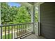 Relaxing porch view of lush green trees from a wooden porch with white railings at 2064 Promenade Ct, Mount Pleasant, SC 29466