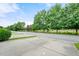 Neighborhood street with a walking path and mature shade trees offering a tranquil environment at 2064 Promenade Ct, Mount Pleasant, SC 29466
