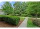 Serene community street with lush landscaping and mature trees, offering a peaceful setting at 2064 Promenade Ct, Mount Pleasant, SC 29466