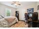 Nice bedroom with queen sized bed, computer gaming area and ceiling fan at 2158 Till Rd, Charleston, SC 29414