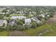 An aerial view of the home with a pond view in a community with mature trees at 228 Beresford Creek St, Charleston, SC 29492