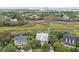 Aerial view highlighting the house's location near a marsh with views toward the shipping port at 228 Beresford Creek St, Charleston, SC 29492