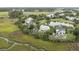 Breathtaking aerial view of homes near lush wetlands, featuring a serene pond and community pool at 228 Beresford Creek St, Charleston, SC 29492