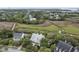 An aerial view of the home site with marsh views, mature trees and a swimming pool at 228 Beresford Creek St, Charleston, SC 29492