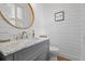 Chic half bathroom with a marble vanity, stylish fixtures, and modern wall detailing at 228 Beresford Creek St, Charleston, SC 29492
