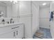 Well-lit bathroom with modern vanity, framed mirror, and shower with modern fixtures at 228 Beresford Creek St, Charleston, SC 29492