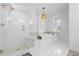 The bathroom showcases a glass enclosed shower and soaking tub beneath a window with bright natural light at 228 Beresford Creek St, Charleston, SC 29492