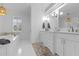 Beautiful bathroom with dual sink vanity, soaking tub, and bright lighting at 228 Beresford Creek St, Charleston, SC 29492
