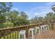 The spacious deck features plenty of room for entertaining and boasts peaceful views of the surrounding trees at 228 Beresford Creek St, Charleston, SC 29492