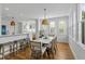 Elegant dining area featuring stylish seating and abundant natural light at 228 Beresford Creek St, Charleston, SC 29492