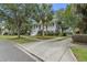 Charming two-story home with a lovely front porch, lush landscaping, and a welcoming entrance at 228 Beresford Creek St, Charleston, SC 29492