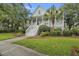 Beautiful two-story home featuring a charming front porch, manicured lawn, and elegant curb appeal at 228 Beresford Creek St, Charleston, SC 29492