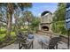 Charming outdoor fireplace area with seating, perfect for enjoying cozy evenings outdoors at 228 Beresford Creek St, Charleston, SC 29492
