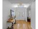 Elegant foyer featuring hardwood floors, a decorative table, and a view of the bright front entryway at 228 Beresford Creek St, Charleston, SC 29492