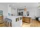 Modern kitchen with stainless steel appliances, white countertops and a wooden island at 228 Beresford Creek St, Charleston, SC 29492