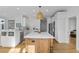 Bright kitchen with a large island, stainless steel appliances, and white cabinets at 228 Beresford Creek St, Charleston, SC 29492