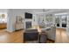 Bright living room with hardwood floors, fireplace, and multiple windows at 228 Beresford Creek St, Charleston, SC 29492