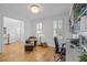 Bright office space featuring hardwood floors, built-in bookshelves, and a comfortable workspace at 228 Beresford Creek St, Charleston, SC 29492