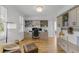 Stylish home office with custom cabinetry, hardwood floors, and a comfortable seating area at 228 Beresford Creek St, Charleston, SC 29492