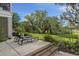Outdoor patio with lounge chairs and lush landscaping, creating a relaxing retreat at 228 Beresford Creek St, Charleston, SC 29492
