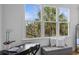 Bedroom window nook shows a view of palm trees at 228 Beresford Creek St, Charleston, SC 29492