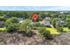 Aerial view of a house with a red pin on top surrounded by trees, with a small pond at 2369 Rice Pond Rd, Charleston, SC 29414
