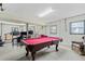 Finished basement includes a pool table, entertainment area, and exercise equipment for versatile living at 2369 Rice Pond Rd, Charleston, SC 29414