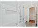 This well-lit bathroom boasts a shower with a decorative niche and a neutral-toned vanity near the doorway at 2369 Rice Pond Rd, Charleston, SC 29414