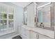 Bathroom vanity with marble countertops, white cabinets, and modern fixtures at 2369 Rice Pond Rd, Charleston, SC 29414