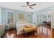 Comfortable bedroom featuring hardwood floors, ceiling fan, and a connecting office at 2369 Rice Pond Rd, Charleston, SC 29414