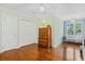 Bright bedroom featuring hardwood floors, a ceiling fan, and cozy reading nook at 2369 Rice Pond Rd, Charleston, SC 29414