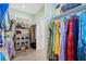 Walk-in closet featuring custom shelving, rods, and storage for clothing and accessories at 2369 Rice Pond Rd, Charleston, SC 29414