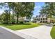 Charming home with a spacious yard, long driveway and a welcoming two-story porch at 2369 Rice Pond Rd, Charleston, SC 29414