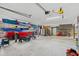 Well-organized garage featuring car, kayaks, and toys, maximizing storage and functionality at 2369 Rice Pond Rd, Charleston, SC 29414