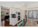 Bright kitchen features white cabinetry, stainless steel appliances, and pass-through to living room at 2369 Rice Pond Rd, Charleston, SC 29414