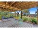 Relax on the covered patio with porch swing and seating overlooking the lush backyard at 2369 Rice Pond Rd, Charleston, SC 29414