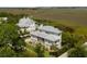 Expansive home surrounded by lush greenery and waterfront views at 2618 Raven Dr, Sullivans Island, SC 29482