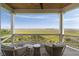 Inviting balcony showcases comfortable seating and serene marsh views at 2618 Raven Dr, Sullivans Island, SC 29482
